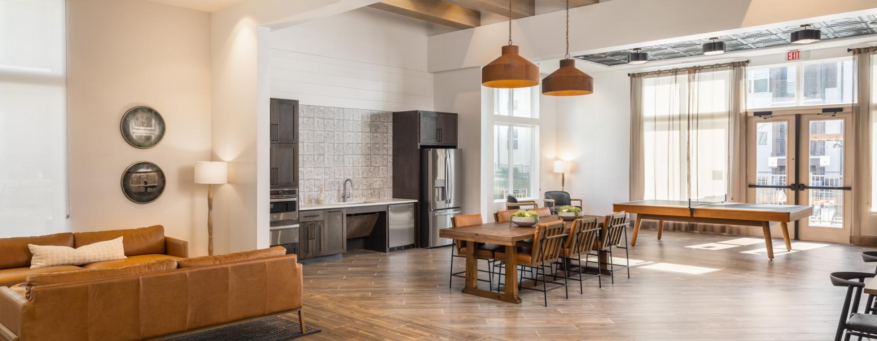 a spacious room with a wood floor and natural light